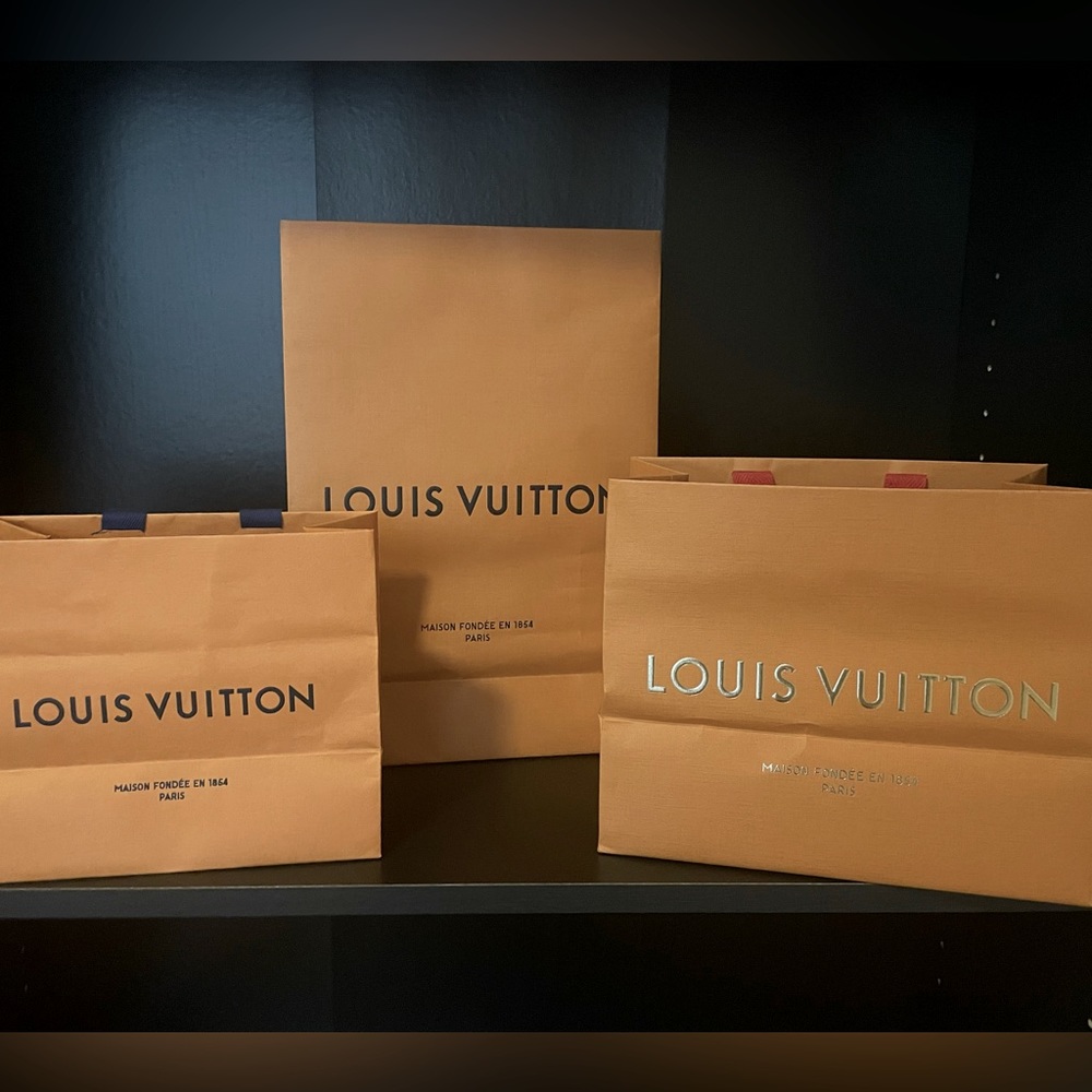 Three authentic Louis Vuitton shopping bags